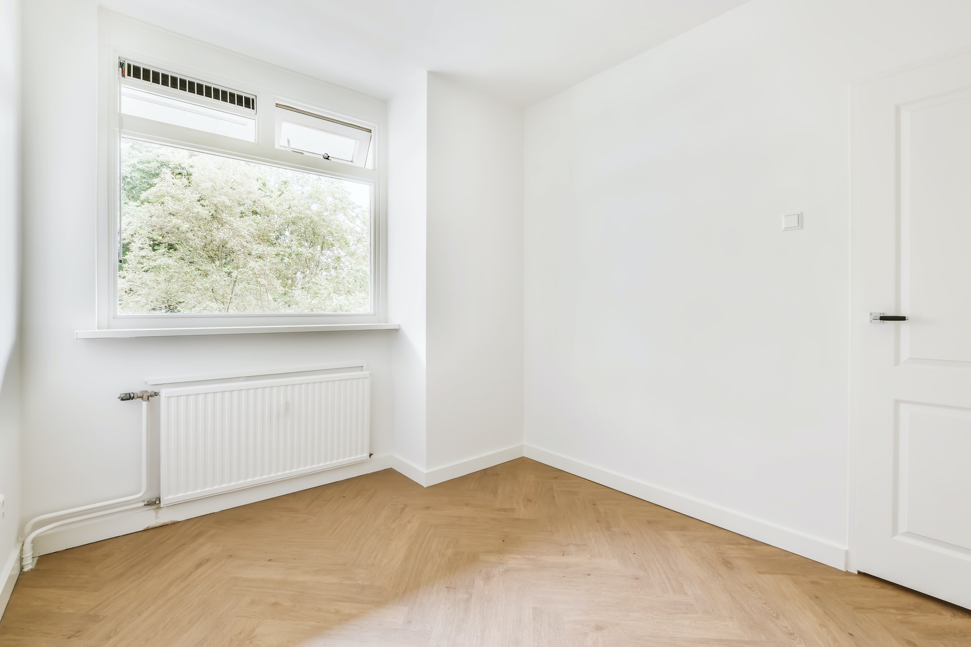 Bright room with parquet flooring